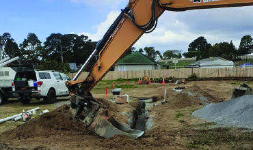 14 tonne excavator digging main sewage lines